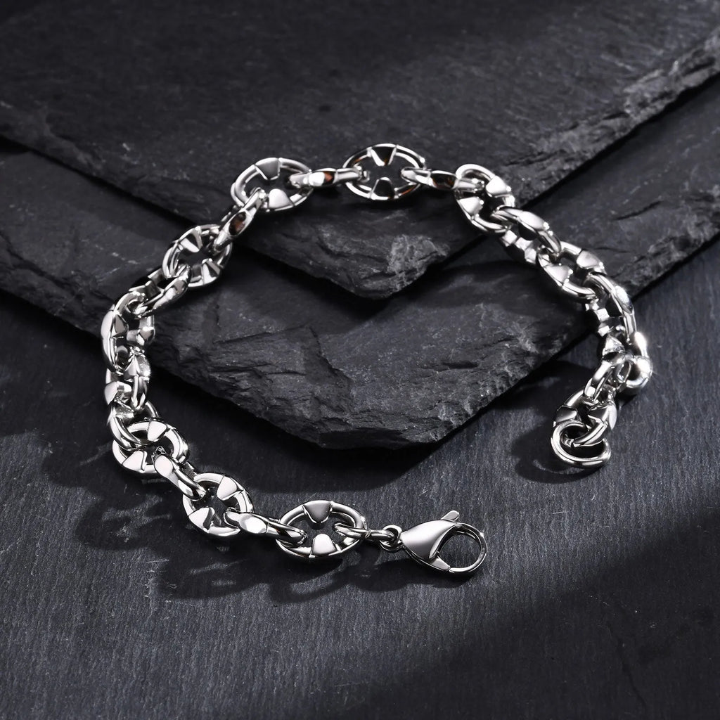 Thick stainless steel handmade chain bracelet with a geometric shape in a steel colour.