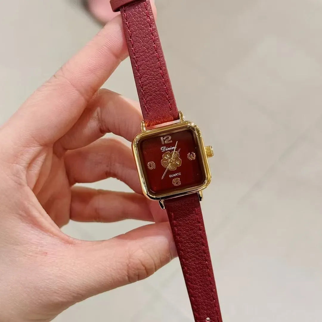 Chinese style red alloy women's wristwatch with a decorative dial on a 8mm thick case.