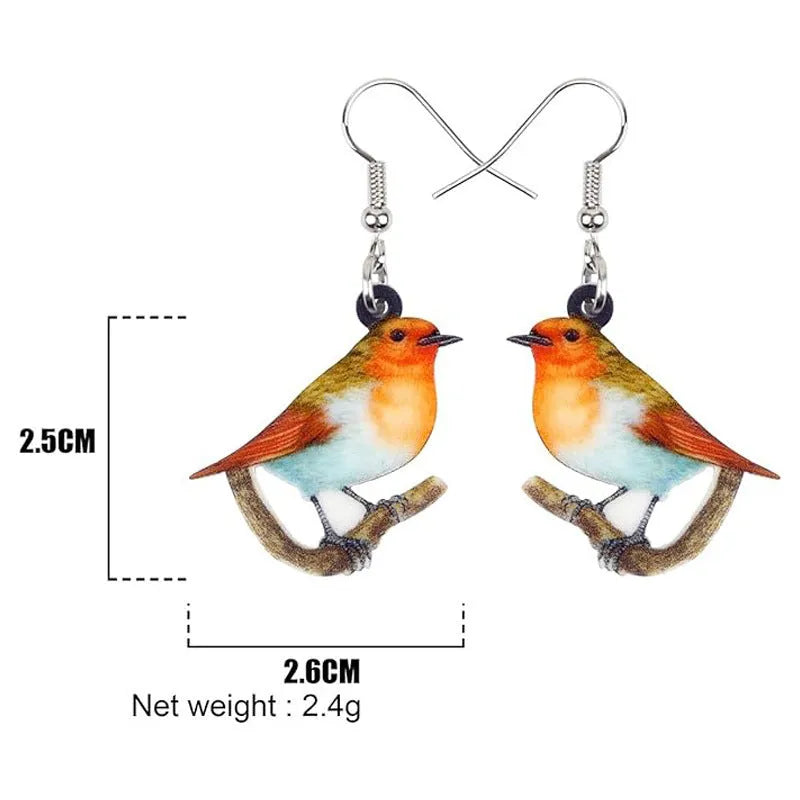 Blue Titmouse bird pendant acrylic earrings with silver snake chain detail on a white background.