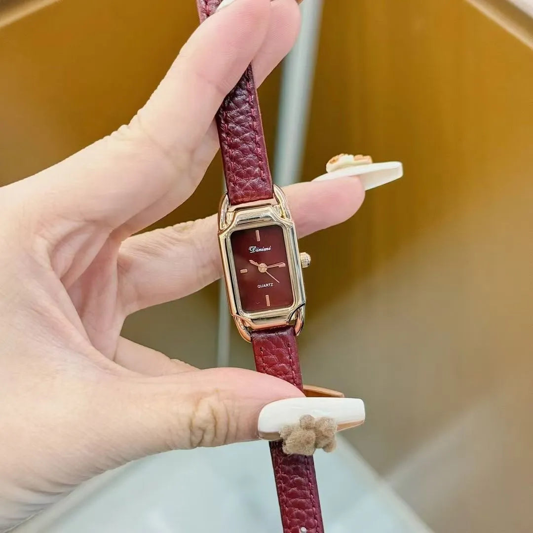 Chinese style red alloy women's wristwatch with a decorative dial on a 8mm thick case.