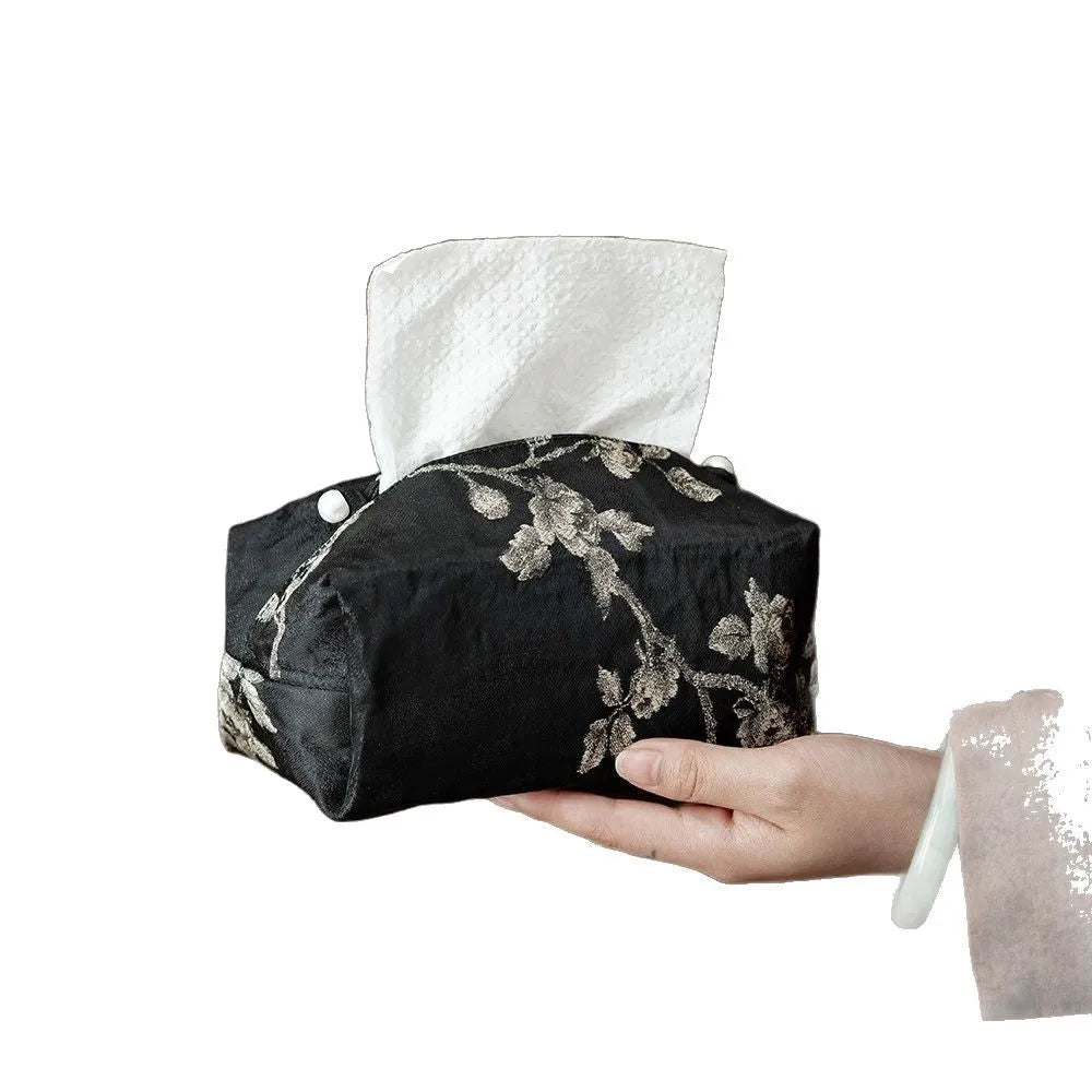 New Chinese style white brocade tissue box cover with embroidered plum blossoms on a table.