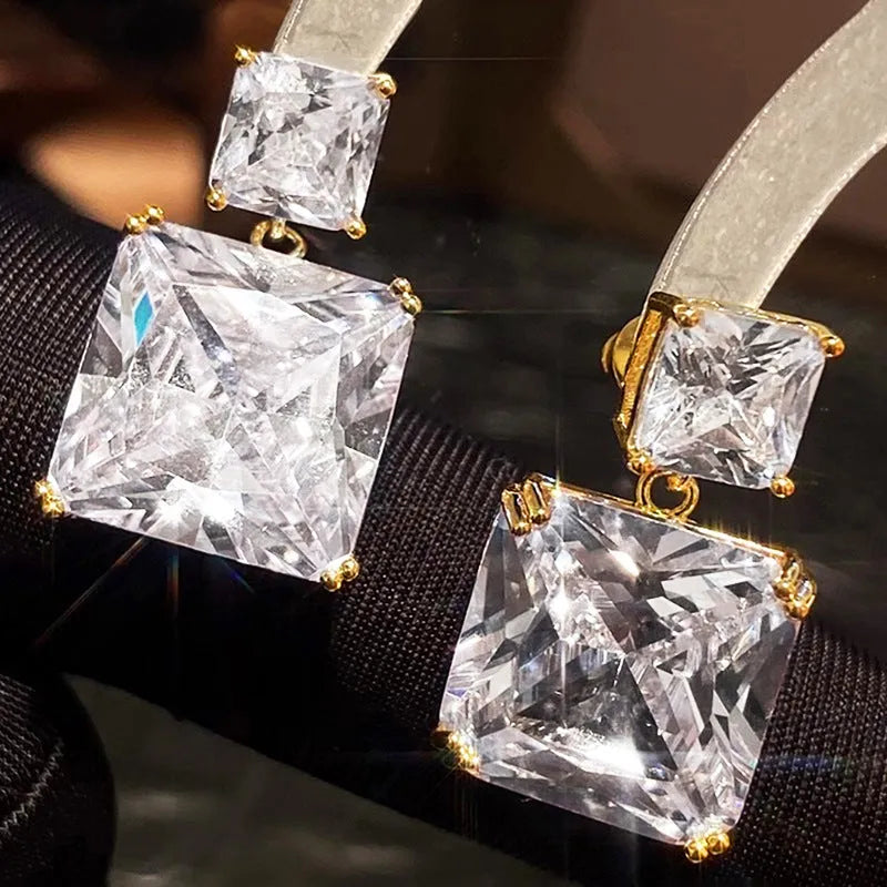 A pair of geometric square copper earrings for women in a choice of gold or white gold tone.