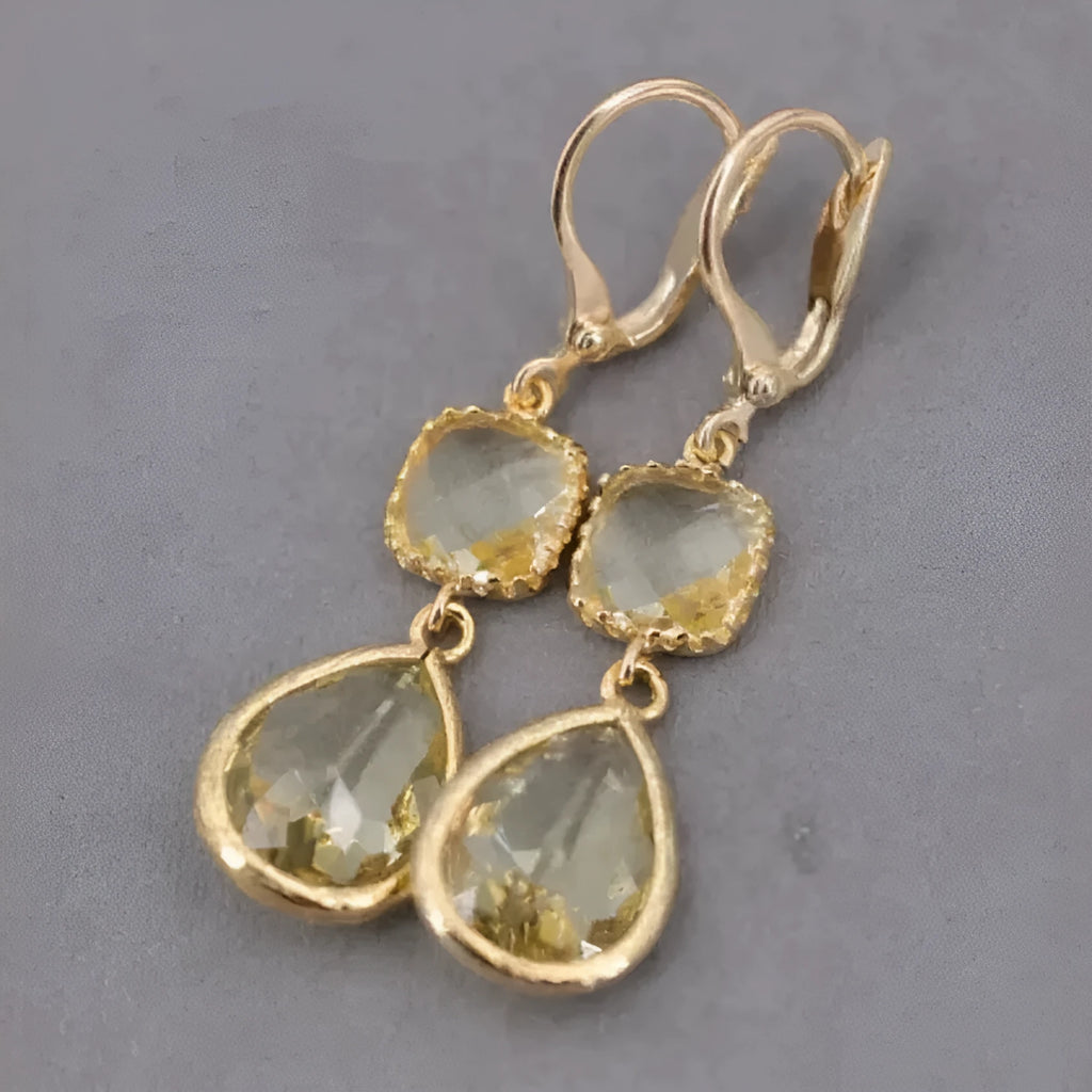 Gold geometric earrings with long crystal fringe and water droplet design on copper base