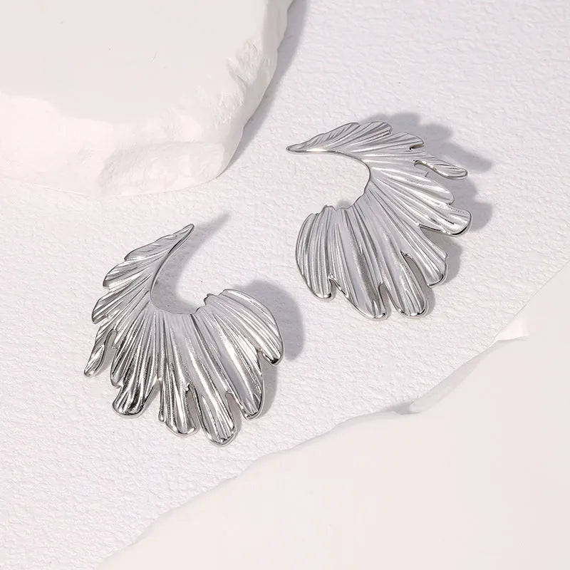 Leaf-shaped alloy earrings with stainless steel construction in gold or steel electroplated finish