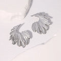 Leaf-shaped alloy earrings with stainless steel construction in gold or steel electroplated finish
