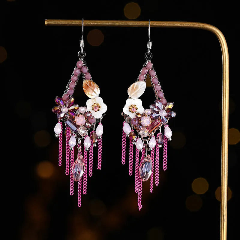 Long bohemian-style women's earrings with hand-woven artificial crystal in a diamond shape.