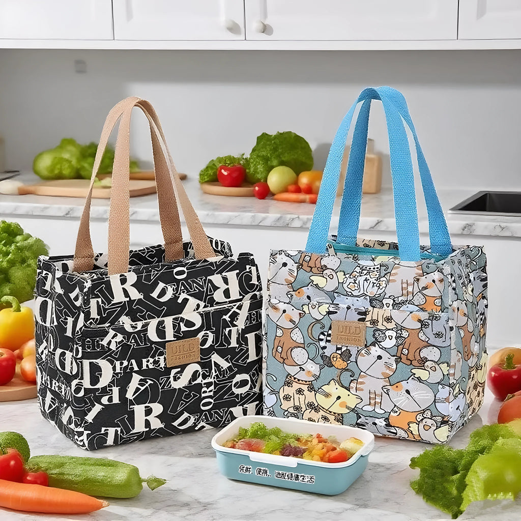 Women's printed canvas tote bag with aluminium handles in a floral or cat design.