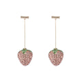 Geometric strawberry-shaped zinc alloy earrings with spot-drill texture, shown in red, on a white background.