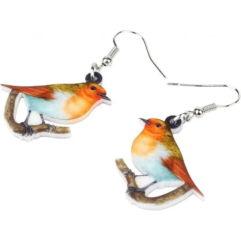 Blue Titmouse bird pendant acrylic earrings with silver snake chain detail on a white background.