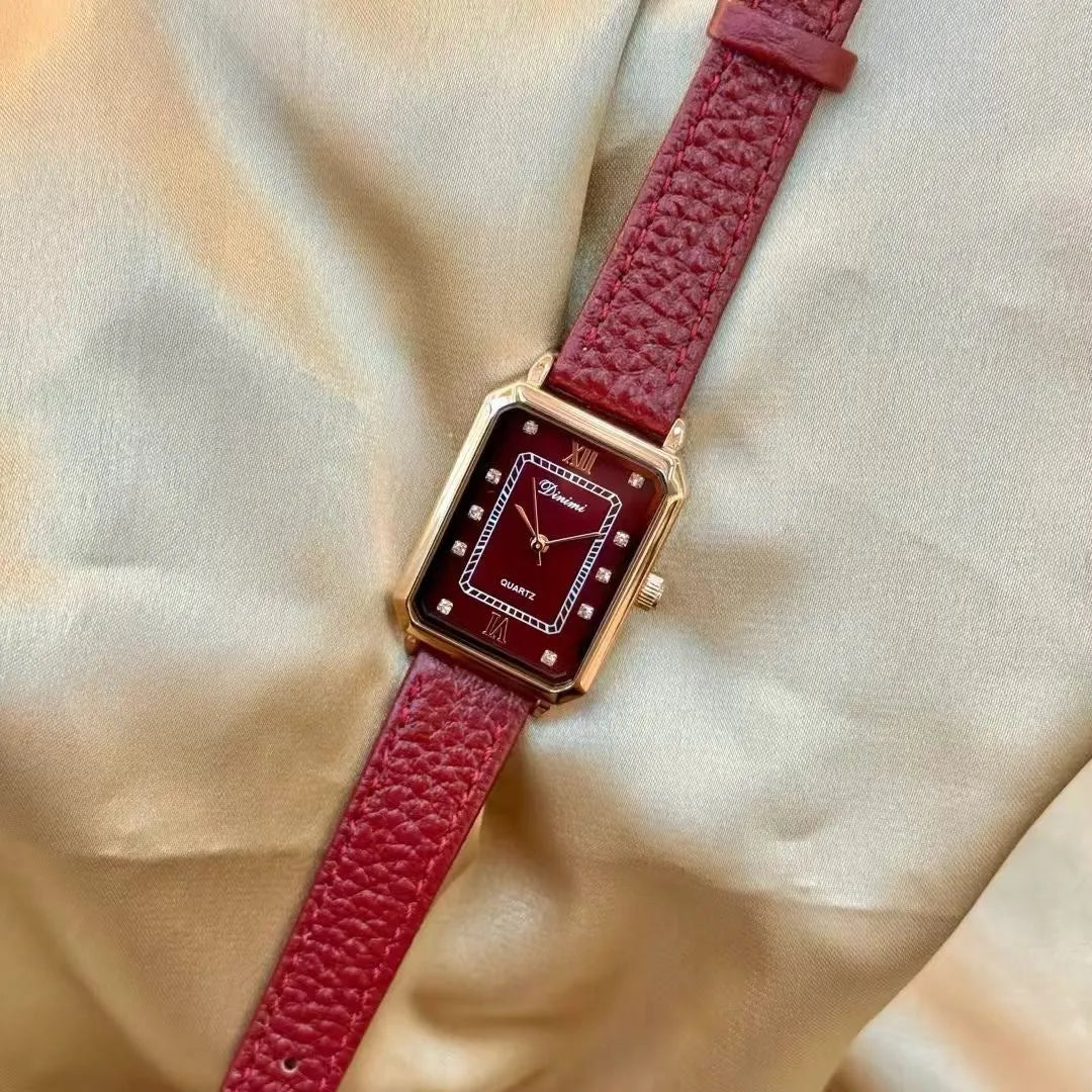 Chinese style red alloy women's wristwatch with a decorative dial on a 8mm thick case.