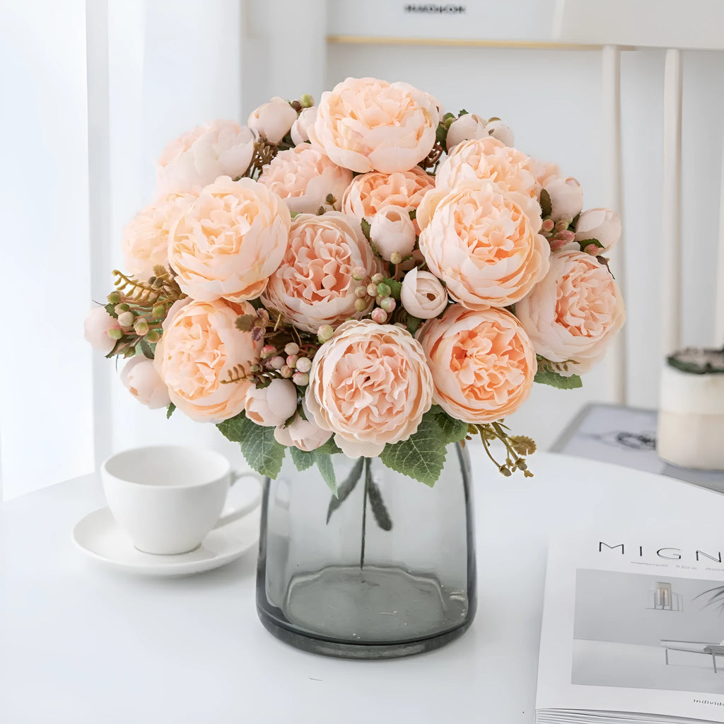 Artificial silk peony bouquet in a vase, showing realistic pink and champagne coloured blooms for home decor.