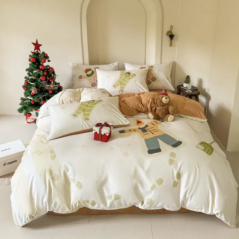 Christmas cartoon printed duvet cover and pillowcase set on a bed, showing Gingerbread Man or Tinker Bell design.