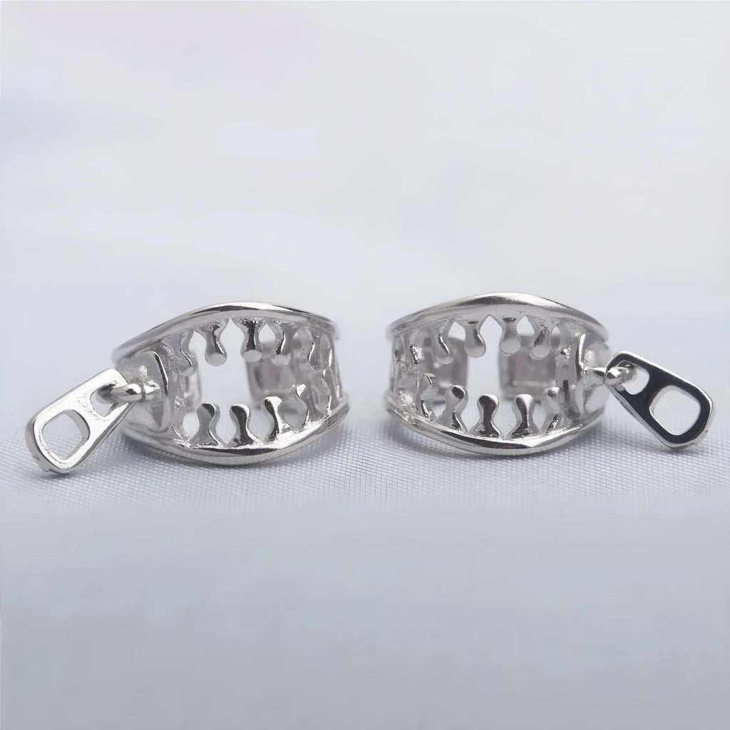 Copper geometric ear clip with line details and a zipper-style clip in colour ES862
