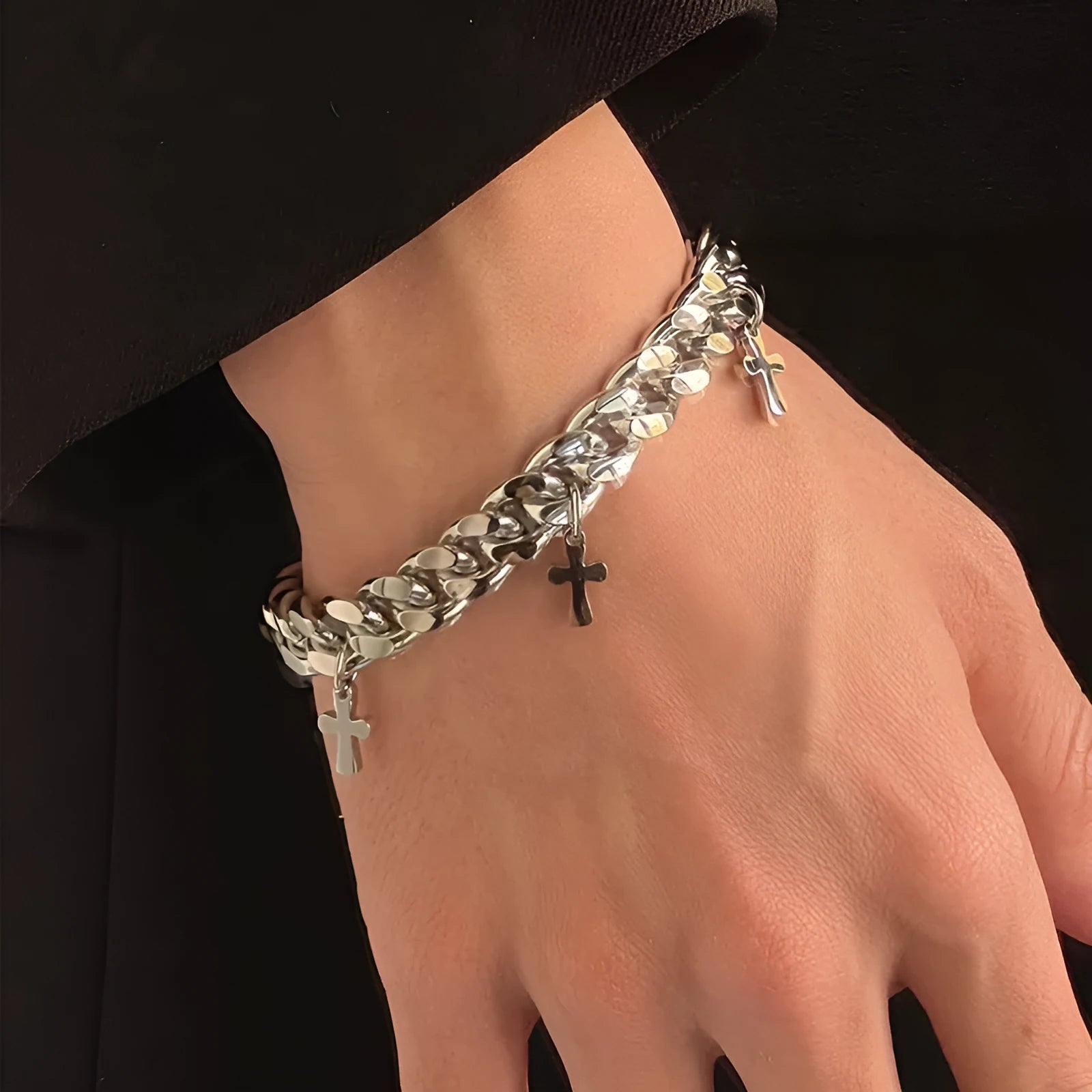 Men's titanium steel bracelet with geometric shape and cross design detail.
