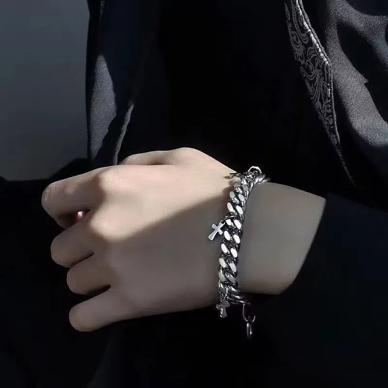 Men's titanium steel bracelet with geometric shape and cross design detail.