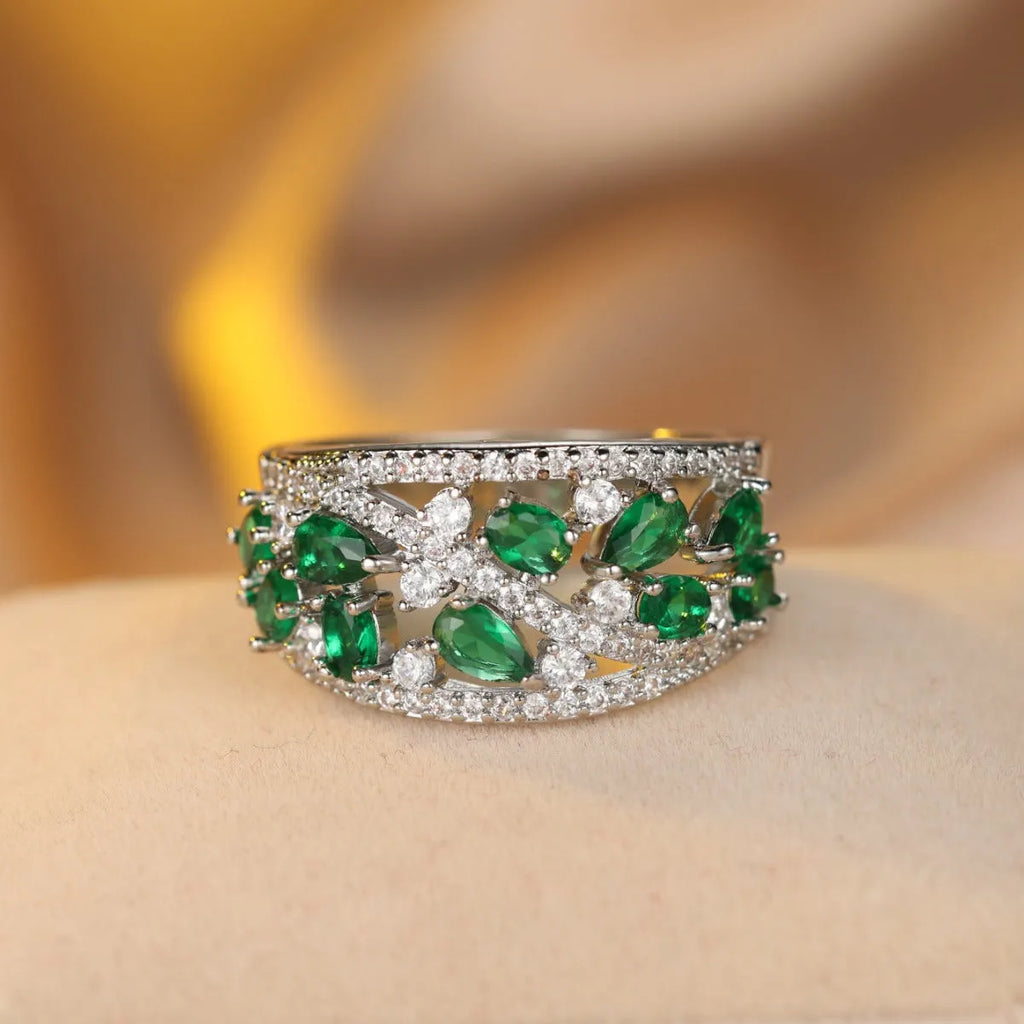 Women's round hollow copper fashion ring with a choice of diamond or sapphire blue gemstone accent.