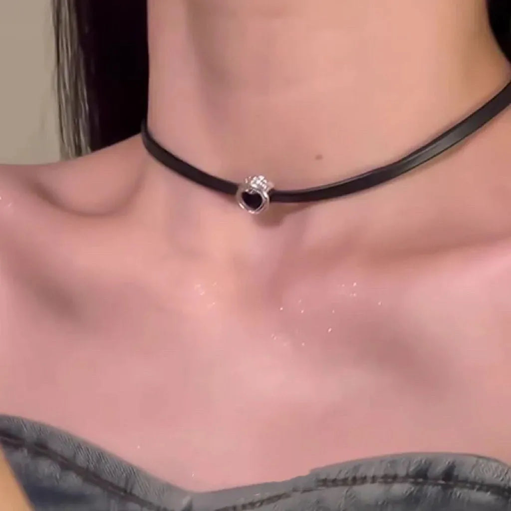 Women's leather and alloy double-layer heart pendant necklace on an adjustable clavicle chain.