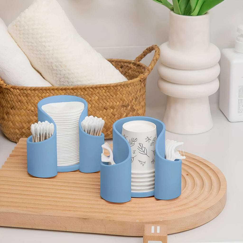 A solid colour plastic cotton box for dental floss storage, shown in black, blue, pink, and white colour options.