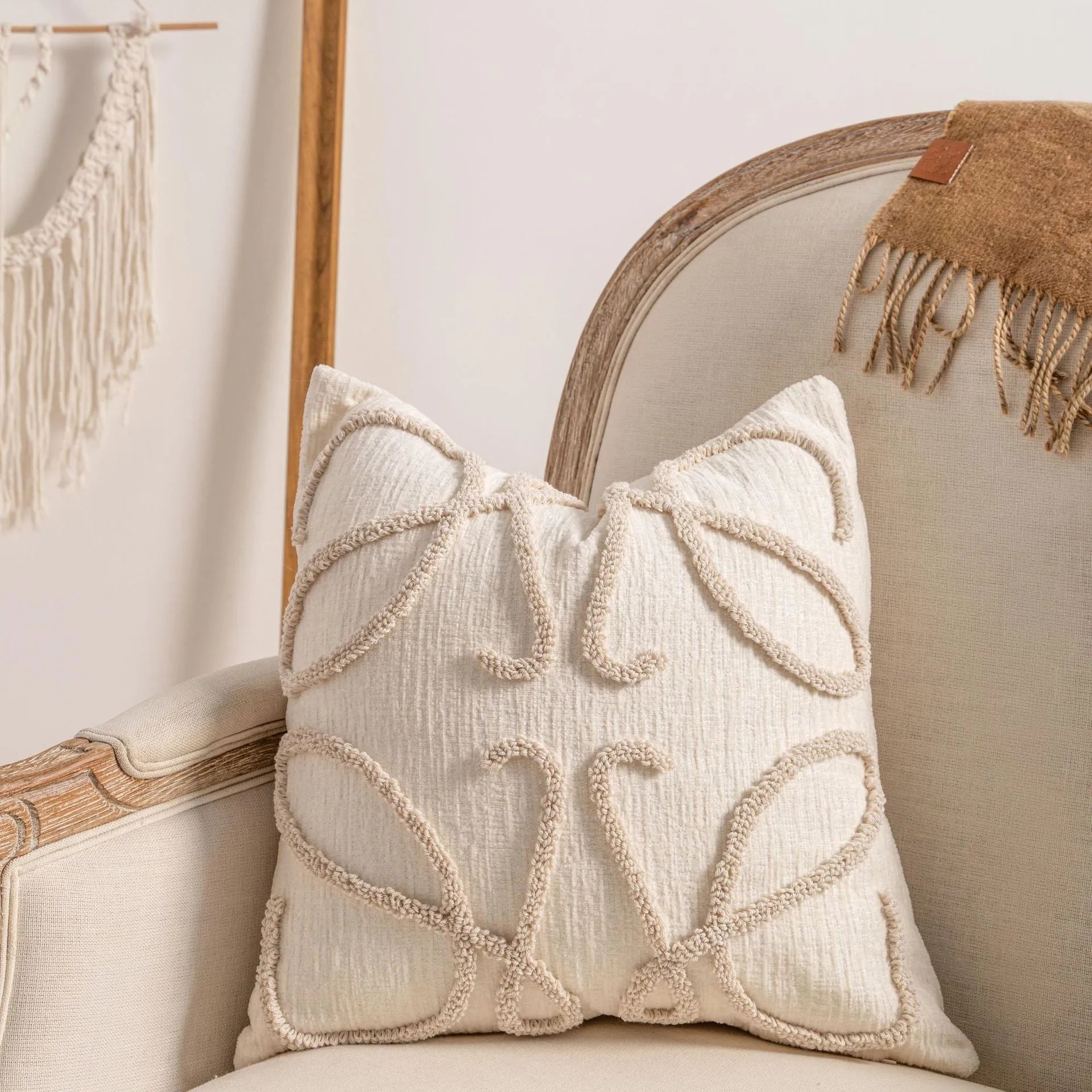 Knitted decorative cushion cover with tassel fringe in spiral dots pattern showing 45x45cm size