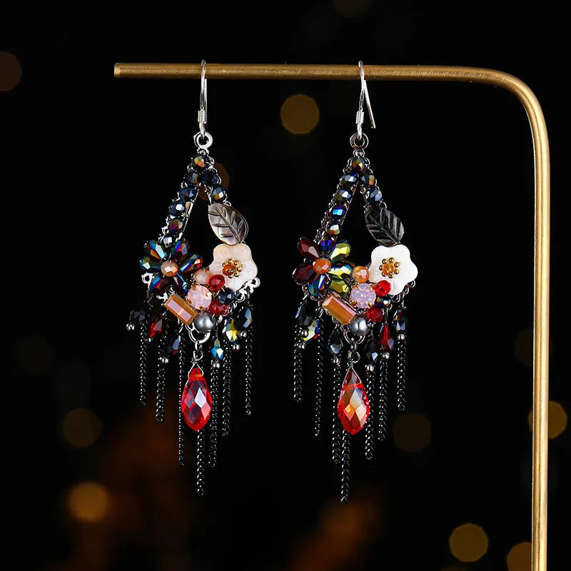Long bohemian-style women's earrings with hand-woven artificial crystal in a diamond shape.