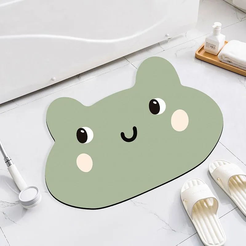 Cartoon animal diatom absorbent bathroom mat in bear pattern on tiled floor.
