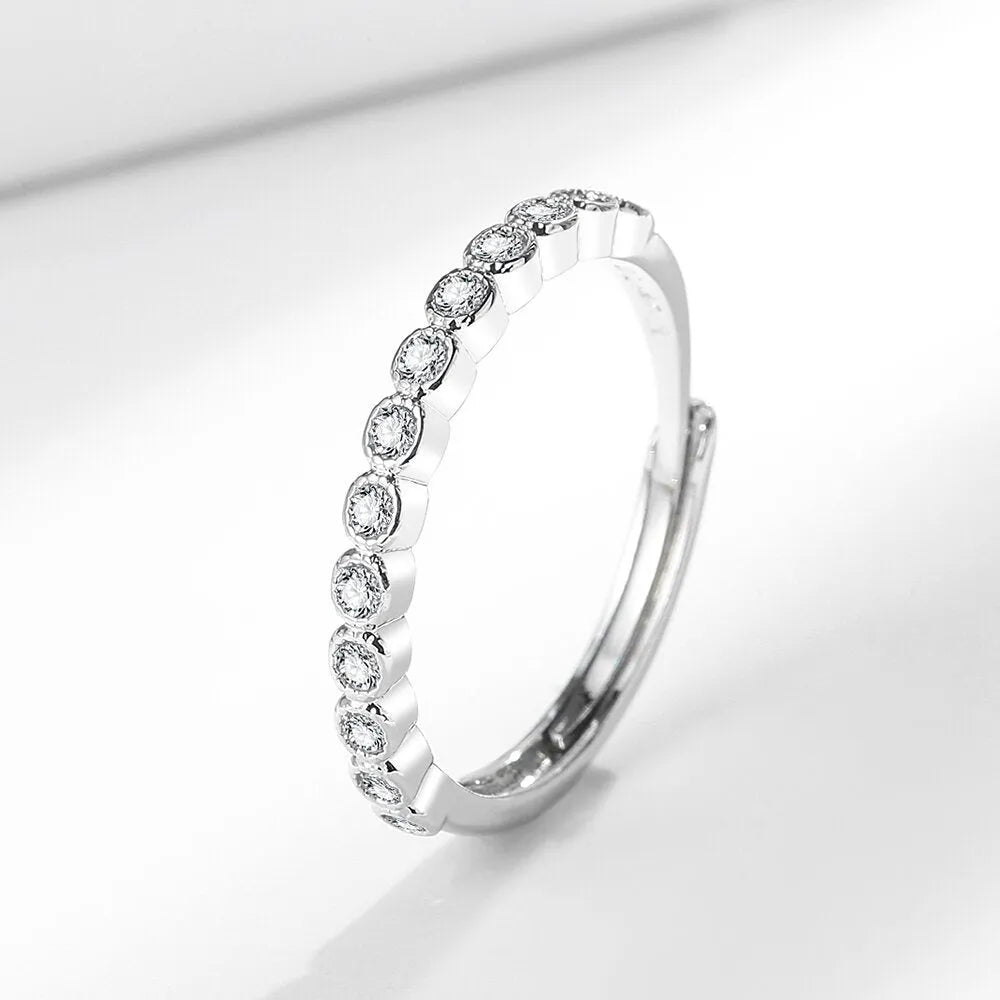 Women's geometric open mouth ring in electroplated gold colour on a plain background.