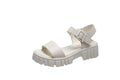 Women's beige platform sandals with peep toe and ankle-strap buckle on white background