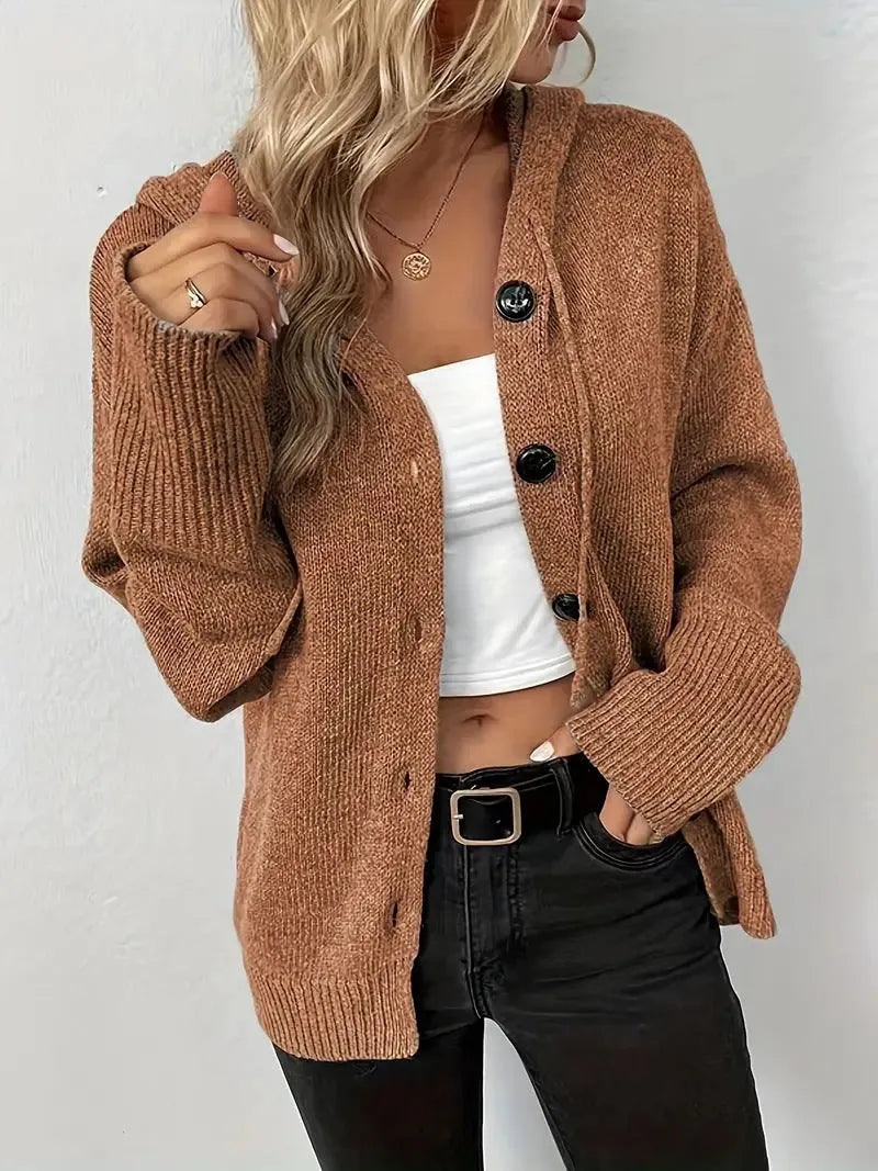 A thick grey cotton hooded cardigan sweater with a single-breasted front and long sleeves, shown on a model.