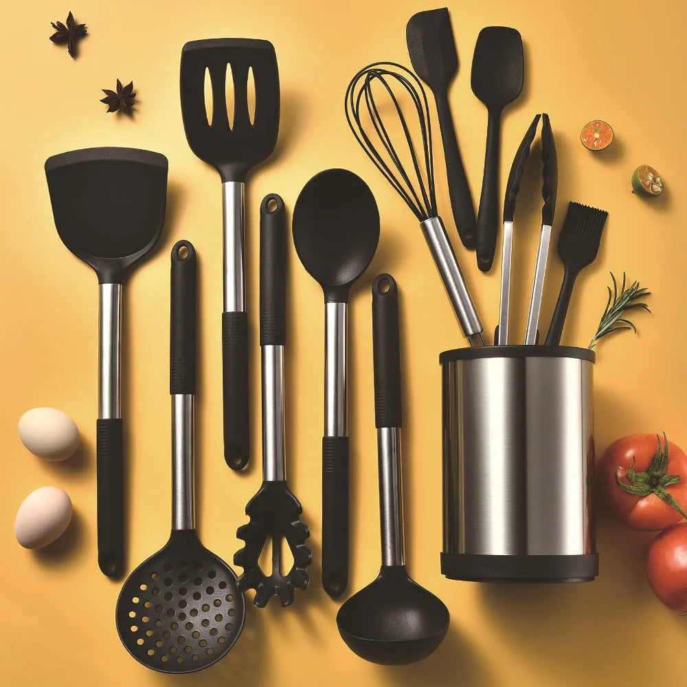 Black silicone kitchen utensil set with 12 tools in a rotating storage bucket on a kitchen countertop