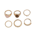 Six light gold electroplated alloy rings in a geometric set with round and ring shapes, style 94509