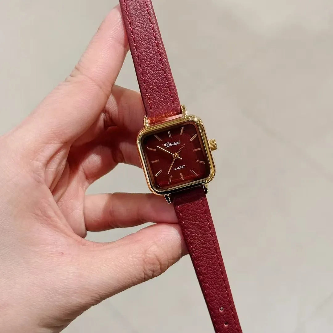Chinese style red alloy women's wristwatch with a decorative dial on a 8mm thick case.