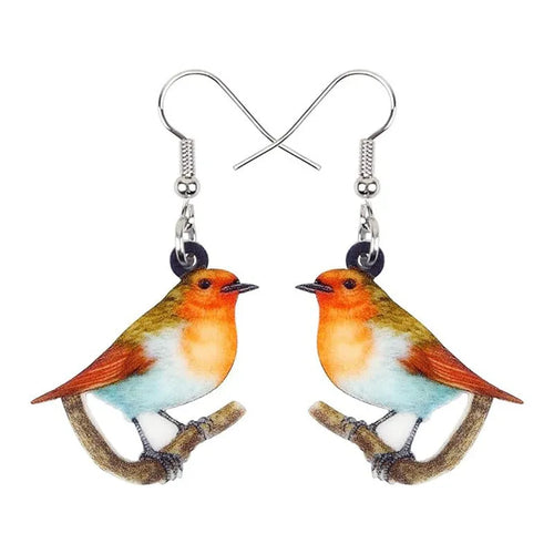 Blue Titmouse bird pendant acrylic earrings with silver snake chain detail on a white background.