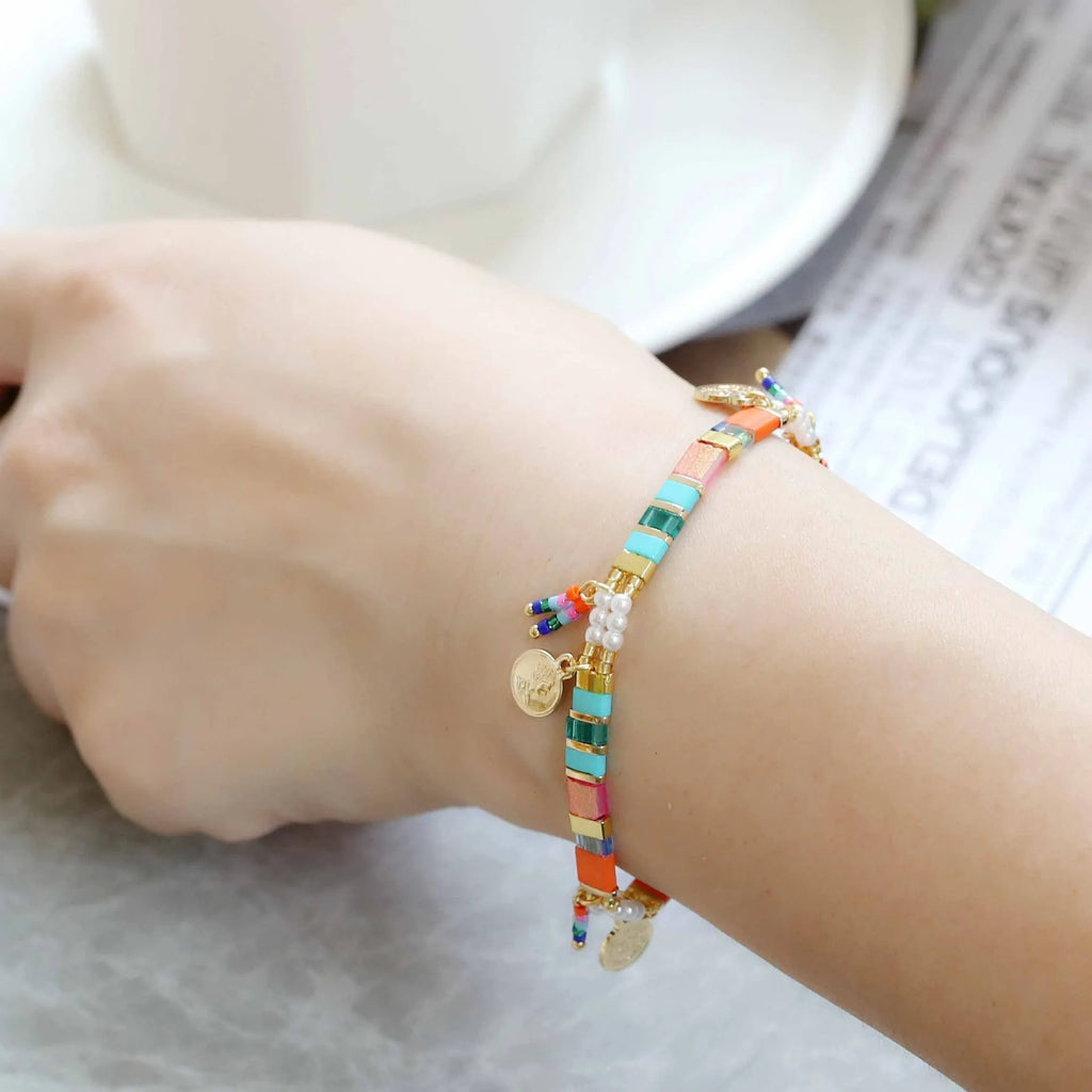 Handcrafted women's beaded bracelet with glass and imitation pearl elements in six colour styles