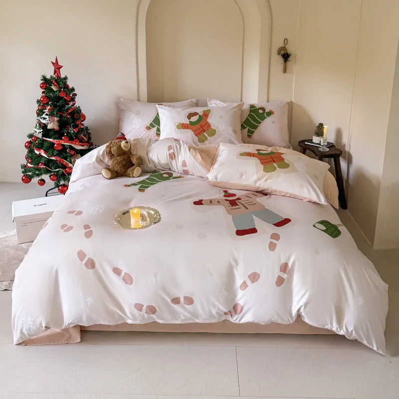 Christmas cartoon printed duvet cover and pillowcase set on a bed, showing Gingerbread Man or Tinker Bell design.
