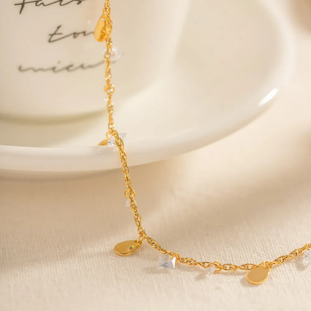 Women's stainless steel anklet with a water drop charm and geometric tassel in colour JDAW2303012.