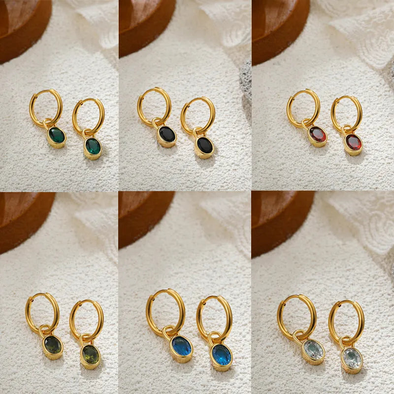 Close-up of women's simple oval zircon stud earrings in copper, showing army green and emerald colour options on a white background.
