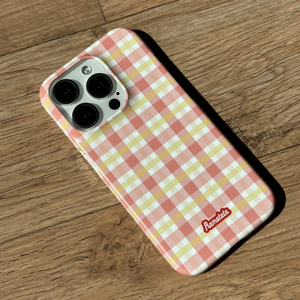 Red and orange plaid iPhone 15 Pro Max phone case with glossy and frosted finish options.