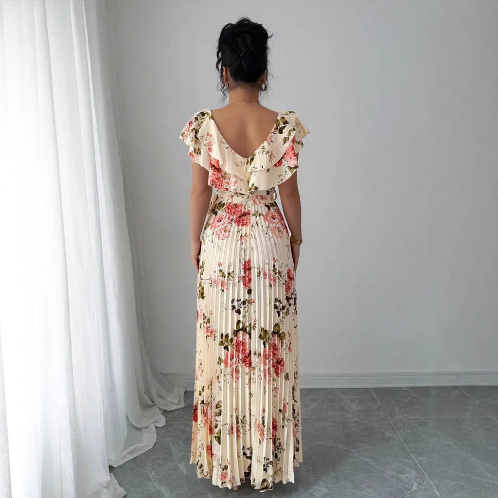 Apricot colour floral print V-neck dress with ruffled short sleeves and a pleated high-waist swing skirt.