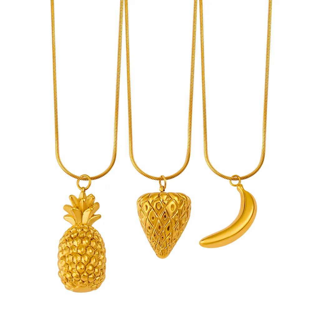 Set of six stainless steel fruit pendant necklaces showing apple, grape, watermelon, pineapple, strawberry, and banana charms on a silver chain.