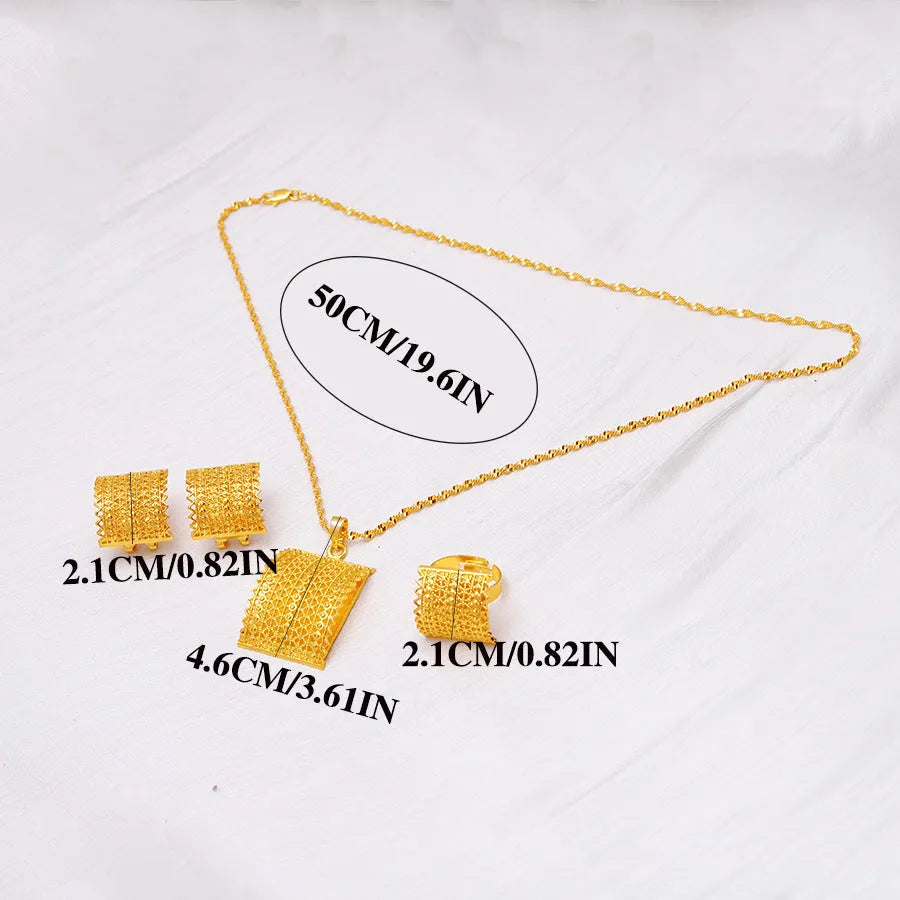 Gold-coloured bridal jewellery set with necklace, earrings, and ring on copper base