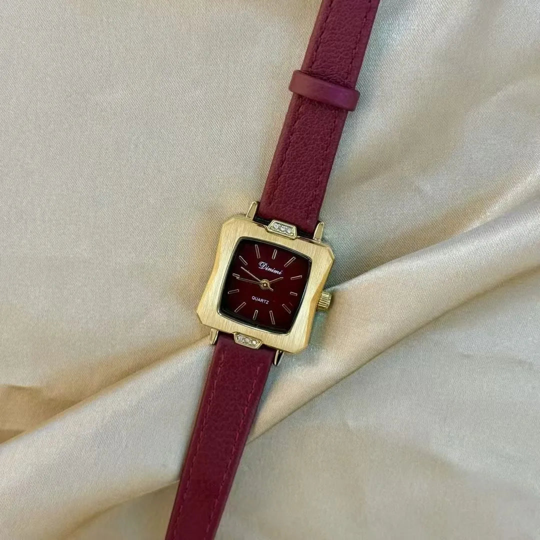 Chinese style red alloy women's wristwatch with a decorative dial on a 8mm thick case.