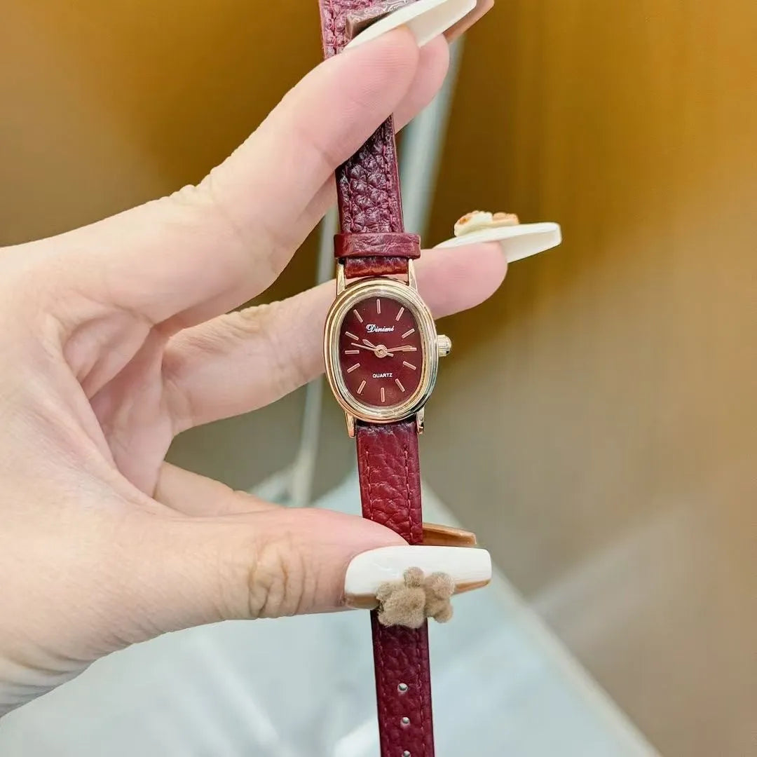 Chinese style red alloy women's wristwatch with a decorative dial on a 8mm thick case.