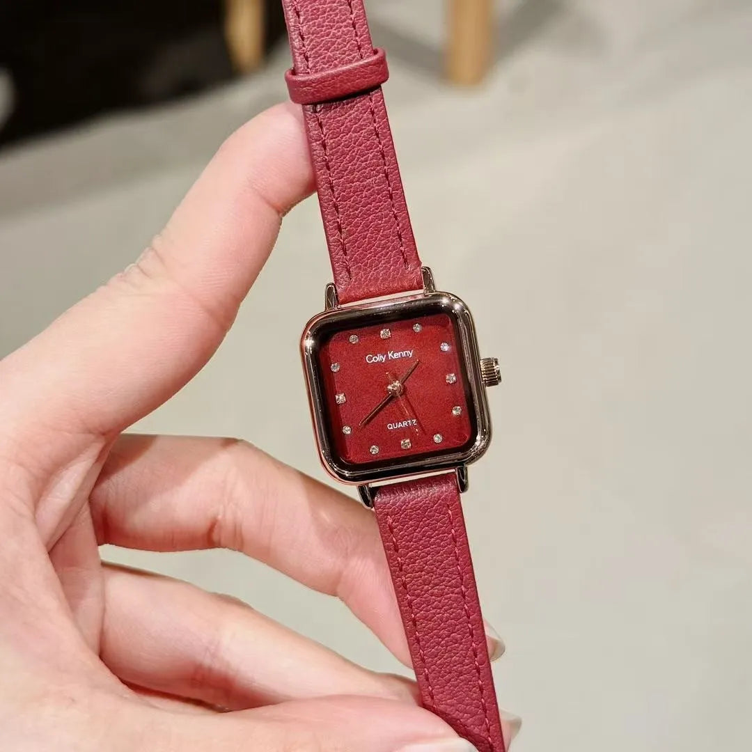 Chinese style red alloy women's wristwatch with a decorative dial on a 8mm thick case.