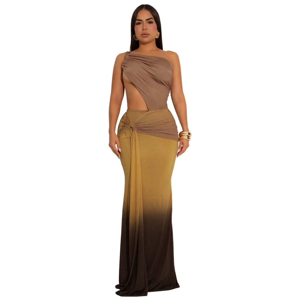 A woman's gradient colour summer dress with a cross-shoulder neckline and a high-waisted long skirt.