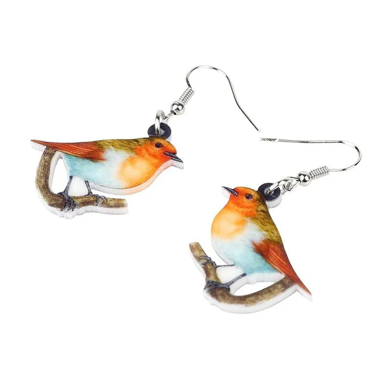 Blue Titmouse bird pendant acrylic earrings with silver snake chain detail on a white background.