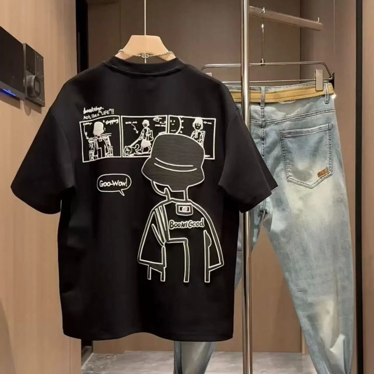 Men's white cotton T-shirt with simple cartoon print showing loose fit and short sleeves