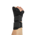Carbon fibre sports wrist guard with thumb strap in black and grey, shown for left hand.
