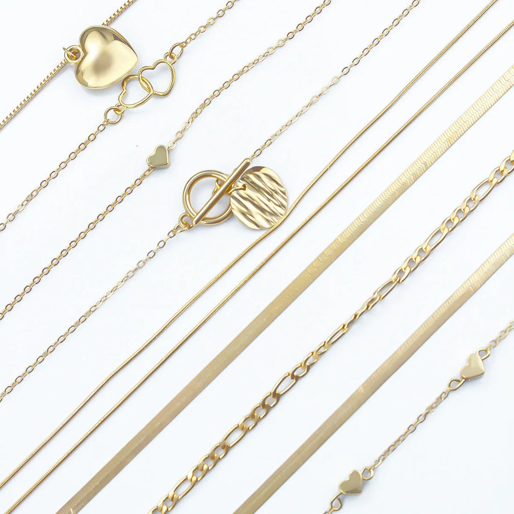 Gold women's 10-piece necklace set with alloy pendant on an adjustable snake bones chain.