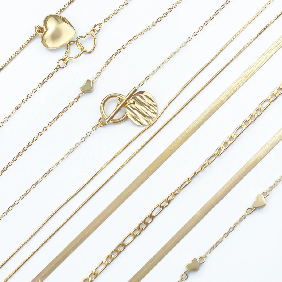 Gold women's 10-piece necklace set with alloy pendant on an adjustable snake bones chain.