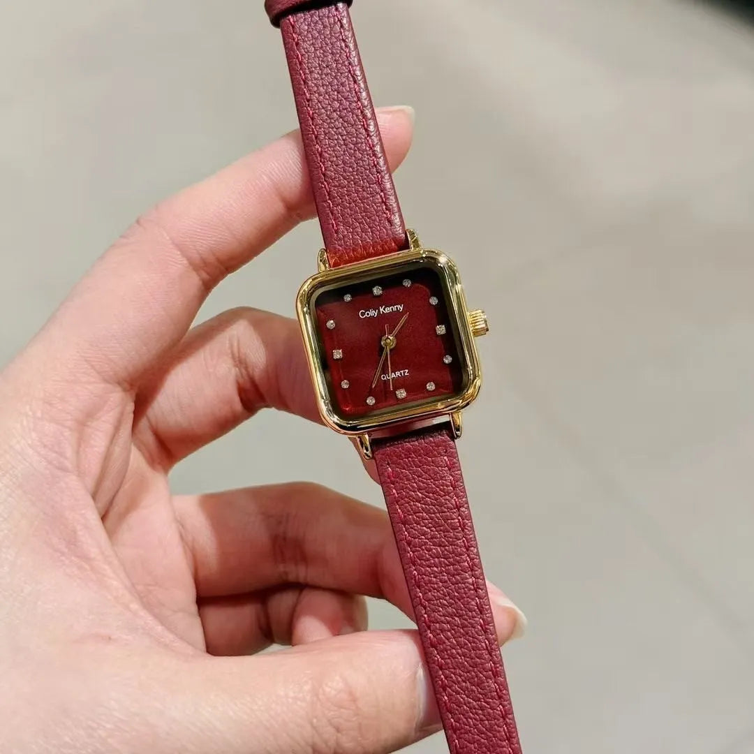 Chinese style red alloy women's wristwatch with a decorative dial on a 8mm thick case.